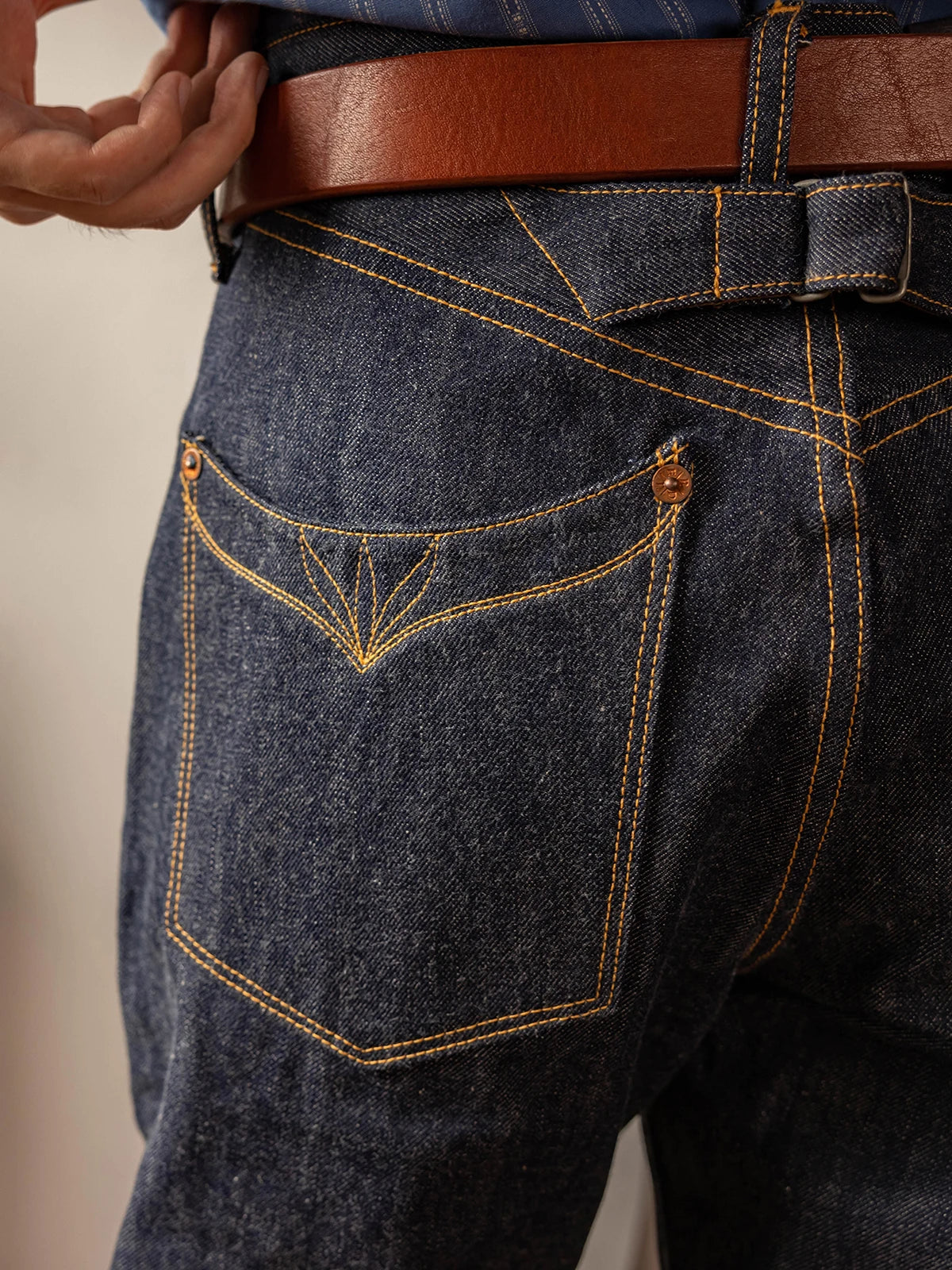 Buckle Back Raw Denim Jeans